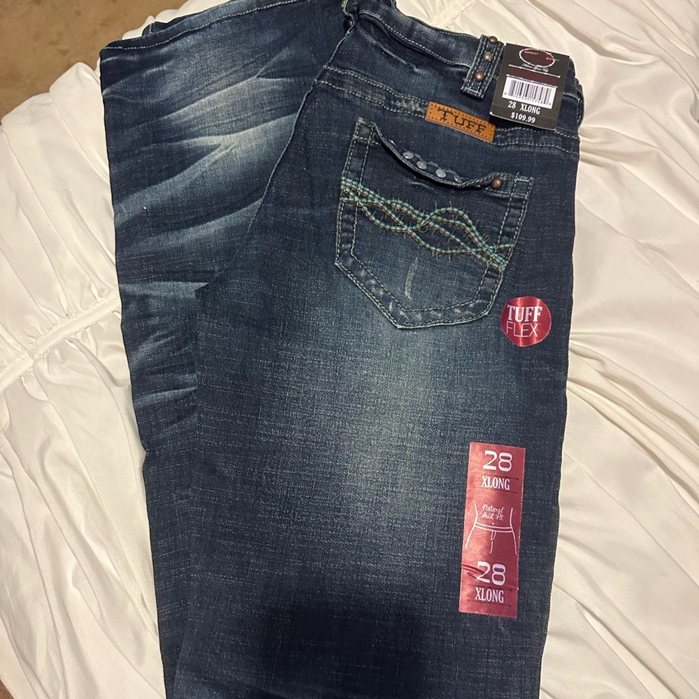Brand new cowgirl tuff. Wild mustang jeans.    Size 28 x 37.